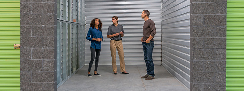 people standing in storage unit